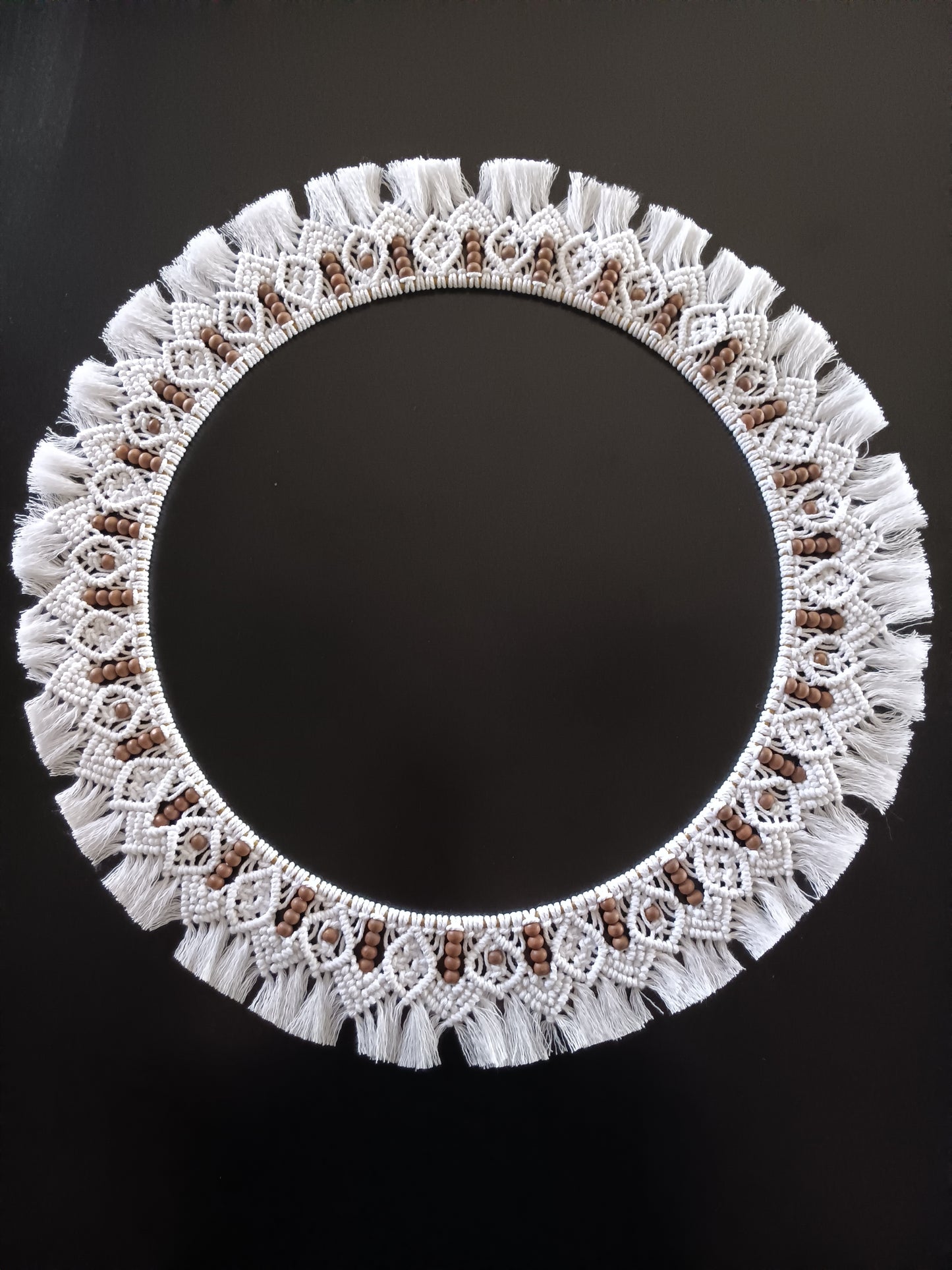 White and dark brown beaded macrame mandala